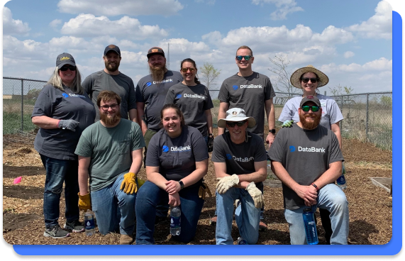 A group of DataBankers posing for a photo while volunteering in their community